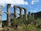 Roman aqueduct between olive trees. Lesvos. Greece