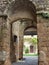 Roman arches leading to a wood door