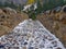 Roman bridge over the Bujaruelo River in the Ordesa National Park in Huesca, Spain. Image of cloudy day with the first snowfalls