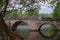 Roman bridge reflection on river Bosna in Sarajevo