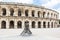 Roman bullfight arena with torero statue in Nimes, France