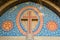 Roman Catholic cross over the entrance of a church