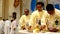 Roman Catholic priests taking communion during congregation mass