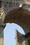 Roman Coliseum seen through the Arch of Constantine.