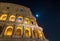 Roman Colosseum at Night under Full Moon and Starlight in Rome, Italy