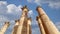 Roman Columns in the Jordanian city of Jerash Gerasa of Antiquity against the background of moving clouds