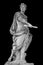 Roman emperor Julius Caesar statue isolated over black background