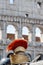 Roman helmet in front of Colosseum in Italy