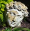 Roman modeled statue head in garden