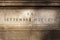 Roman numerals on bas-relief on travertine stone. Equestrian monument of garibaldi. Rome, Italy