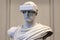 Roman sculpture wearing virtual reality goggles. Generative AI