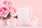 Romance festive mockup - delicate pastel pink flowers, gift box, heart with gentle ribbon and bow on white wooden table.