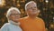 Romance at old age. Retired couple enjoying autumn picnick. Looking at each other