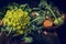 Romanesco Cauliflower on rustic kitchen table with vegetables over wooden background