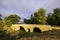 Romanesque bridge of Artigue and river Osse near Larressingle on route to Santiago de Compostela, UNESCO World Heritage Site,