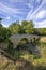 Romanesque bridge of Artigue and river Osse near Larressingle on route to Santiago de Compostela, UNESCO World Heritage Site,