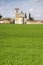 Romanesque medieval Church immersed in a wheat field near a cemetery