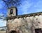 Romanesque medieval San Esteban Church. Bell tower and tree, side view. Allariz, Orense, Spain.