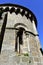 Romanesque style sample, arched window in apse. San Juan de Ribadavia Church Order of Saint John with blue sky. Ribadavia, Spain
