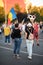 Romania, Bucharest - August 11, 2018: Protester girls displaying centenary icon as handcuffs