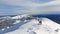 Romania, Ciucas Mountains, hikers descend from Ciucas Peak.