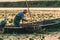 ROMANIA, DANUBE DELTA, AUGUST 2019: Fisherman throwing the smallest fish back into the water