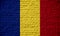 Romania flag, brick wall texture concept