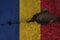 Romania flag on cracked wall. Earthquake or drought concept