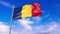 Romania flag waving against blue sky, perfect for news, digital composition