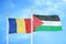 Romania and Palestine two flags on flagpoles and blue sky