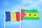 Romania and Sao Tome and Principe two flags on flagpoles and blue sky