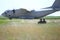 Romanian army soldiers patrol on a military air base, with an Alenia C-27J Spartan military cargo plane from the Bulgarian Air