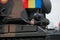 Romanian army tank driver inside an armored vehicle at Romanian National Day military parade