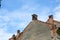 Romanian ceramic shingle roof with brick chimney