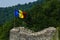 Romanian flag on ruined castle Poenari, Dracula castle, Romania