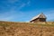 Romanian old sheepfold on the hill in the fall season