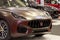 Romaniaâ€“2022-Front-side view with detail of a luxury sports brown car Maseratti Levante,premium car.