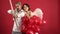 Romantic angels couple aiming with bow, arrow and wings. Valentine`s day Ideas. Red heart. Dating concept.