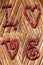 Romantic background on antique wood and red word love impressed above