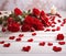 romantic background with red flowers and hearts and white wooden table floor