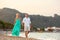 Romantic beach couple walking at sunset