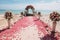 Romantic beach wedding venue embellished with vibrant red and pink roses