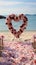 Romantic beachside vows Roses, heart decor in a small, charming wedding