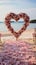 Romantic beachside vows Roses, heart decor in a small, charming wedding