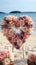 Romantic beachside vows Roses, heart decor in a small, charming wedding