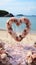 Romantic beachside vows Roses, heart decor in a small, charming wedding