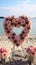 Romantic beachside vows Roses, heart decor in a small, charming wedding