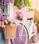 Romantic Bike with Colorful Wild Flower Basket Leaning on the Wall- Generated Artificial Intelligence -AI