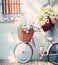 Romantic Bike with Colorful Wild Flower Basket Leaning on the Wall- Generated Artificial Intelligence -AI