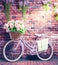 Romantic Bike with Colorful Wild Flower Basket Leaning on the Wall- Generated Artificial Intelligence -AI